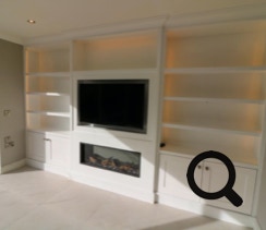 Tv unit with built in fire place and display shelves